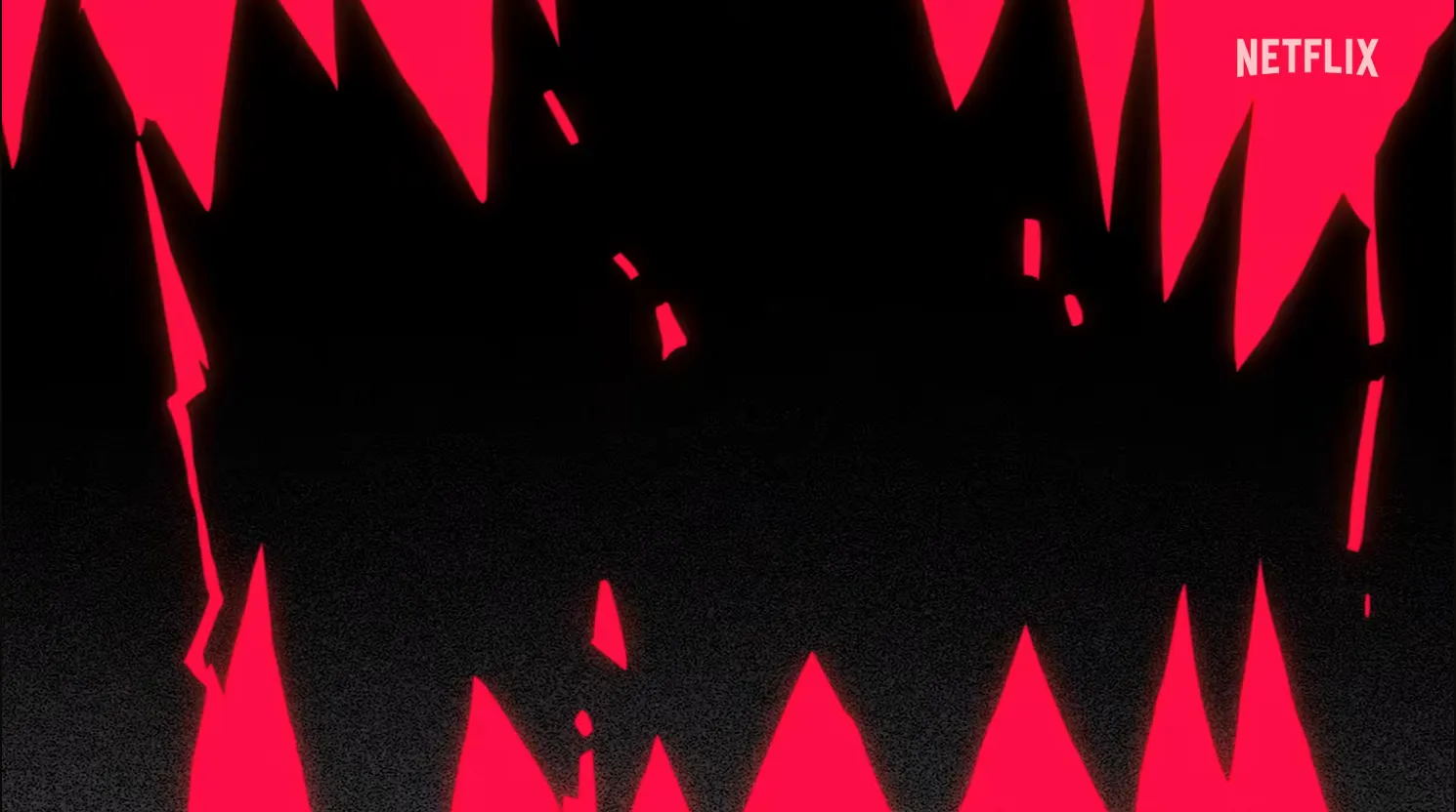 Red jagged triangles bordering a black screen